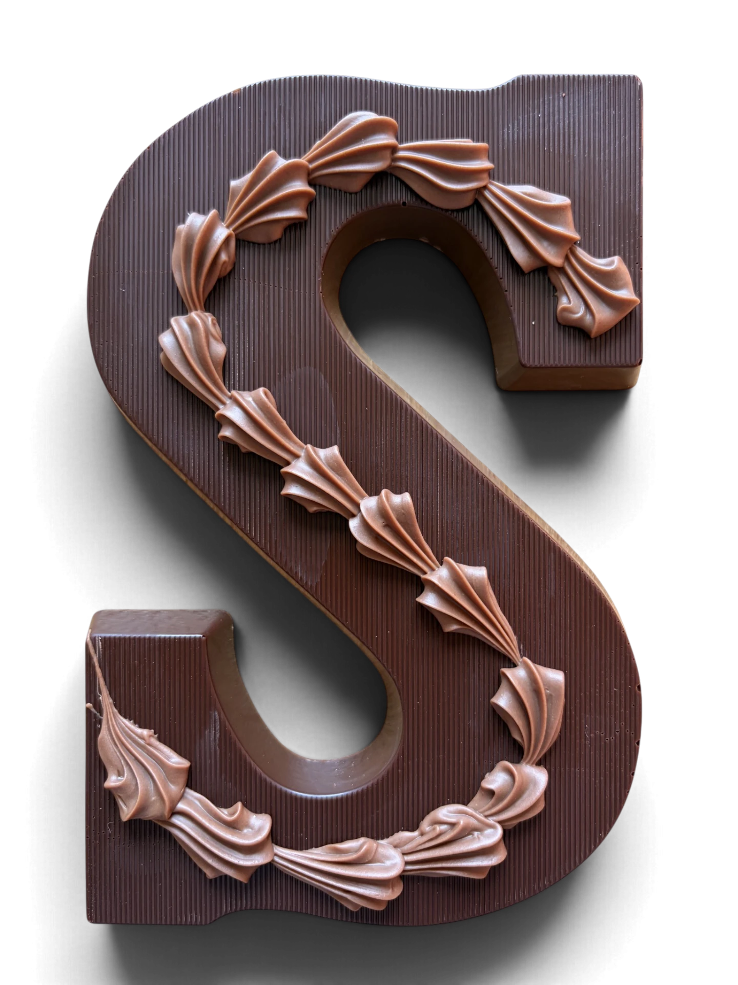 Chocoladeletter S, puur, Melkchocolade-rozetten