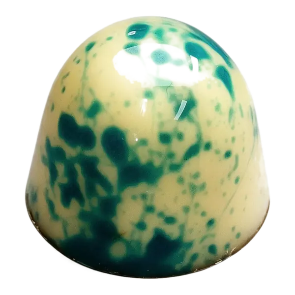 Kokos: lichte ronde bonbon met blauwgroene spikkels