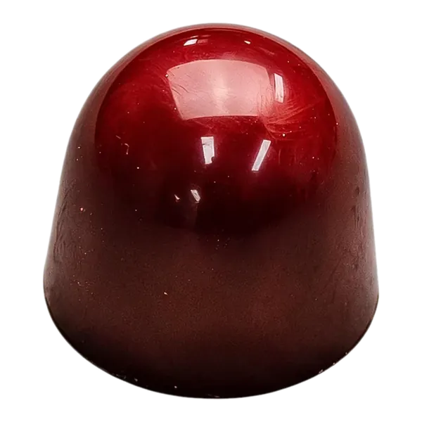 Karamel-zeezout: glanzende donkerrode ronde bonbon